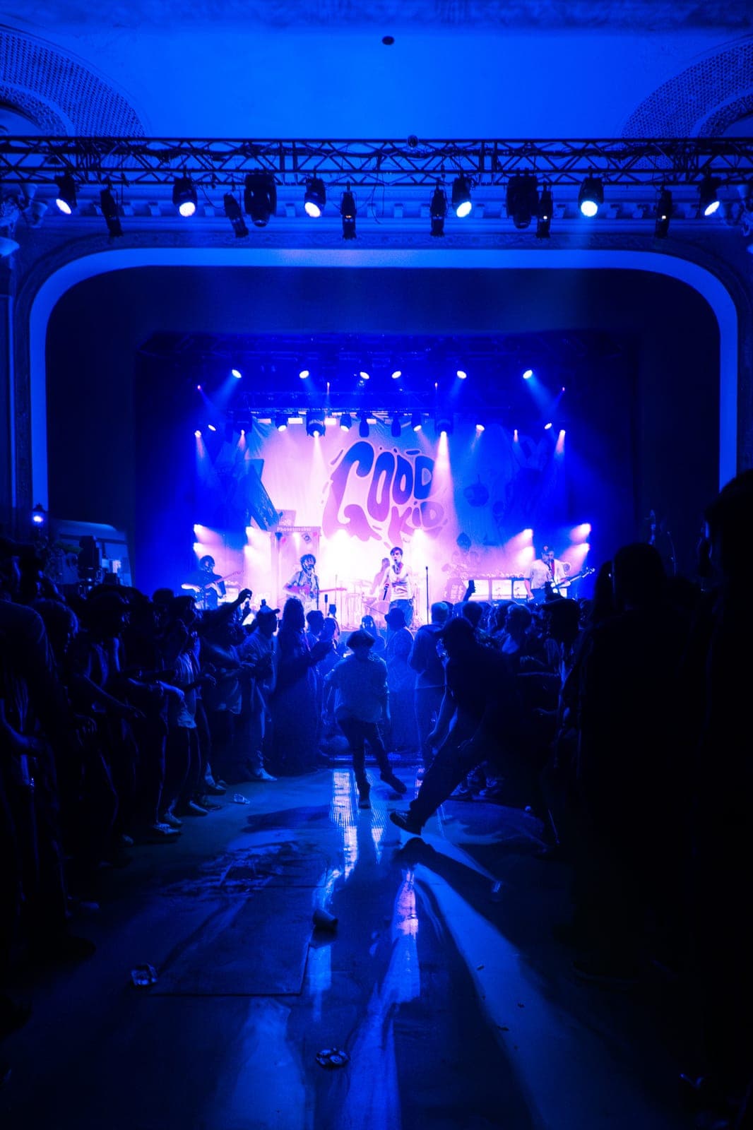 Good Kid play their GOOD KID-emblazoned stage as the blue-lit Danforth Music Hall crowd dances in Toronto